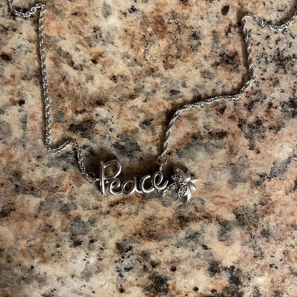 Kay Jewelers “Peace” necklace, with tiny diamonds
